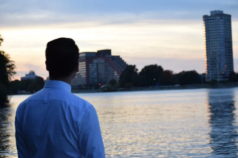A photo of me looking over the Charles into the horizon.